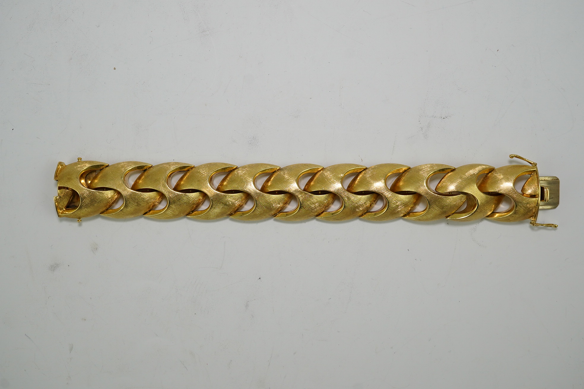 A stylish early 1970's brushed 18ct gold bracelet